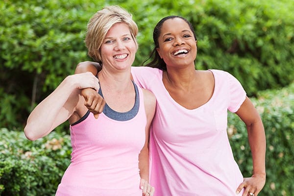 Two women in pink shirts